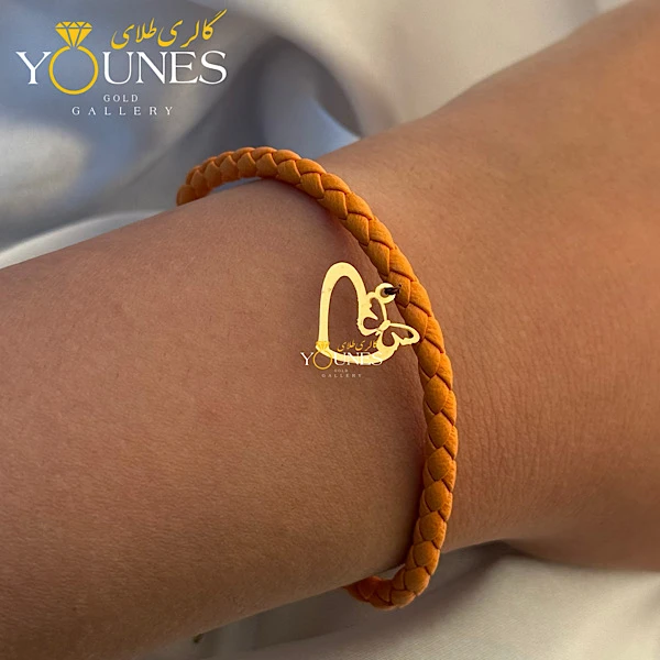 دستبند چرم نارنجی شاپرک قلبی طلا